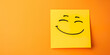 Smiley face on sticky note, happiness concept