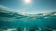 © anandart - Underwater view of sea water surface with sun rays and blue sky. High quality photo