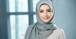 © pham - Smiling Woman Wearing Hijab at Camera, Portraying Positivity and Empowerment.