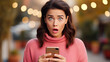 Young surprised shocked amazed excited woman reading message in phone, copy space for advertisement of shocked afraid woman looking with eyes having wide open, Valentine day, sale, women