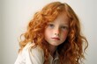 Portrait of a red-haired girl with freckles.