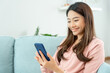 © Shisu_ka - woman using smartphone for online shopping at home. Hand holding mobile phone with payment detail page display and credit card, stay home, technology, electronic commerce, internet, market place