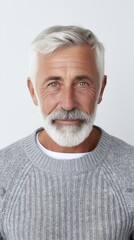 Poster - Stock image of an elderly man in a sweater against a white backdrop Generative AI