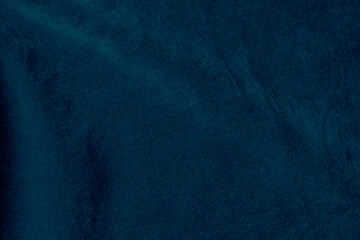 Dark blue velvet fabric texture used as background. silk color denim fabric background of soft and smooth textile material. crushed velvet .luxury navy blue dark tone for silk.