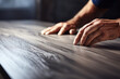 Worker hands installing wooden laminate floor