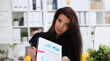 © H_Ko - Female arm show stats graphic clipped to pad in office portrait. Stock exchange market advisor participation in negotiation study trade process white collar inspector check or explain money data