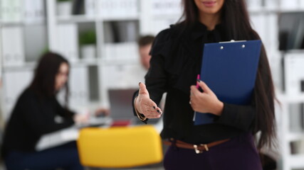 Wall Mural - Woman hold document pad give arm as hello in office closeup. Friend welcome mediation offer positive introduction thanks gesture summit participate approval motivation male arm strike bargain