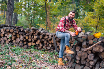 Wall Mural - A close-up of the hipster woodsman with an axe casually slung over his shoulder.