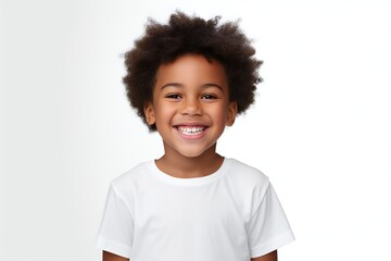 a professional portrait studio photo of a cute african boy child model with perfect clean teeth laughing and smiling. isolated on white background. for ads and web design