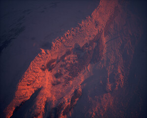 Wall Mural - Aerial of rough terrain with rocks and mountains covered in snow at sunrise.