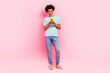 Full length photo of handsome young male chatting eshopping hold device wear trendy blue garment isolated on pink color background