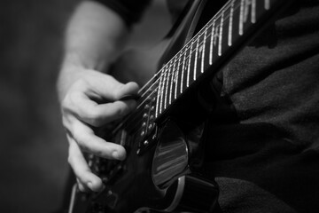 Electric guitar player's hands, live music