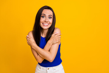 Sticker - Photo of pretty funky lady dressed blue top freezing hugging herself empty space isolated yellow color background