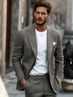 © mariiaplo - Man's fashion, t-shirt under a suit. urban sophistication through a versatile, minimalist style and a muted palette.