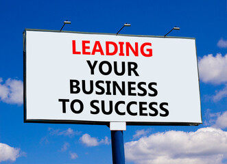 Wall Mural - Leading your business to success symbol. Concept words Leading your business to success on beautiful billboard. Beautiful blue sky background. Leading your business to success concept. Copy space