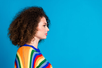 Wall Mural - Photo portrait of lovely young lady profile look empty space wear trendy rainbow print garment isolated on blue color background