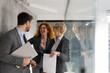 © Novak - Business people walking and talking at business center