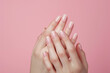 © graphicbeezstock - female hands with a manicure, clean and smooth Asian woman's white hands
