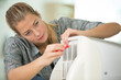 © auremar - female technician cleaning air conditioner indoors