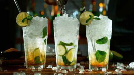 Wall Mural - Close-up of preparing mojito cocktails on a bar