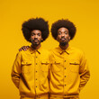 © DALU11 - Two African twins on yellow background.