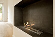© ADDICTIVE STOCK - the fireplace in the living room is clad in slate