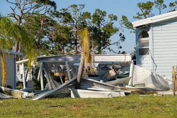 Poster - Natural disaster consequences. Severely damaged by hurricane mobile homes in Florida residential area