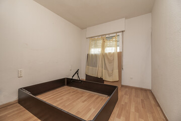 An empty room with white painted walls