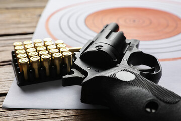 Sticker - Shooting target, handgun and bullets on table, closeup