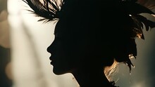 A Side Profile Shot Of A Womans Face, With A Bold Pea Feather Headpiece P Over Her Hair, Providing A Unique And Captivating Silhouette.
