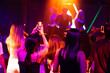 © NVB Stocker - Audience Captures the show with smartphone. music concert live on stage. diverse young people dancing in night club. Nightlife and disco dance party concept. Fun music festival