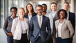 © Kowit - Portrait of successful group of business people at modern office looking at camera. Portrait of happy businessmen and satisfied businesswomen standing as a team. Multiethnic group of people smiling.