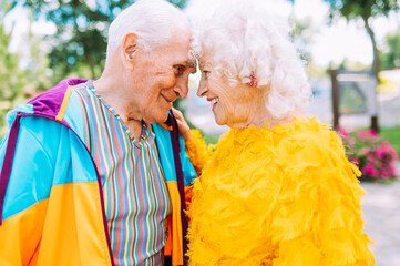 Wall Mural - old modern couple dressing fashionable colored clothes