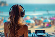 Beautiful glamorous girl DJ at the DJ console, playing music, wearing large headphones. beach summer landscape on blurred background. beach party concept