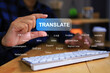 Businessman using translator application to translate foreign languages for many country around the world on computer to conduct global business with international market place