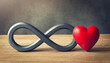 The infinity symbol with a red heart next to it, concept of eternal love