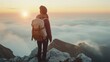 Hipster young girl with backpack enjoying sunset on peak of foggy mountain. Tourist traveler on background view mockup. Hiker looking sunlight