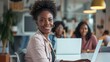© Rakchanika - Group of African American creative businesswomen start-up looking camera working with colleagues sitting in workplace room, home office with technology laptop computer, teamwork entrepreneurship