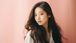 © Synthetica - Portrait of beautiful asian girl with long hair on pink background