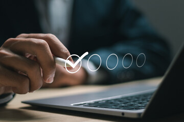 Wall Mural - Businessman fill out business checklist survey to track business performance, filling out digital form checklist, take an assessment, questionnaire.