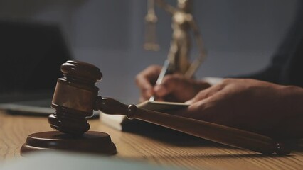 Wall Mural - justice and law concept.Male judge in a courtroom on wooden table and Counselor or Male lawyer working in office. Legal law, advice and justice concept.