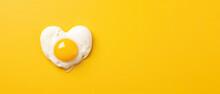 Heart Shaped Fried Egg With Toast As Breakfast For Valentine's Day. Top View. Isolated On Yellow Background. Banner