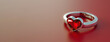 heart shaped ring on red background