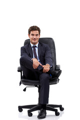 Wall Mural - Happy, businessman and portrait of manager in a chair with white background or mock up space in studio. Confident, entrepreneur and relax on seat with professional style, fashion or suit for work