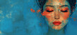 Portrait of a beautiful young Asian woman. Close up front face view of female with perfect skin and gorgeous appearance on bright red lips on blue wall background