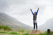 © Alexandra/peopleimages.com - Athlete, mountain peak space or hands up for celebration in training, exercise or workout success. Excited man, sky mockup or hiker with fun energy, gratitude or freedom in nature for fitness goals