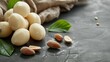 Marzipan balls with almonds on the grey table banner. Suitable for a culinary book with recipes or for table mats design