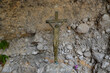 stone cross on the wall