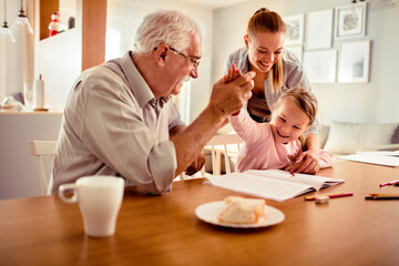 Multi-generational family bonding during homework time at home