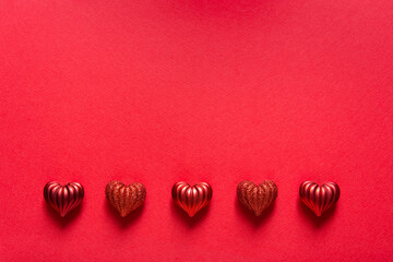 Sticker - Valentines day card mockup with red hearts on red paper background, top view, copy space.	